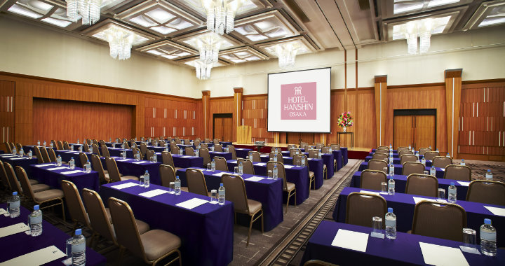 Conference room 'Ball Room' with purple clothing and wood walls at Hotel Hanshin Osaka